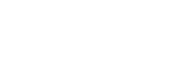 An anvil in a workshop with broken windows